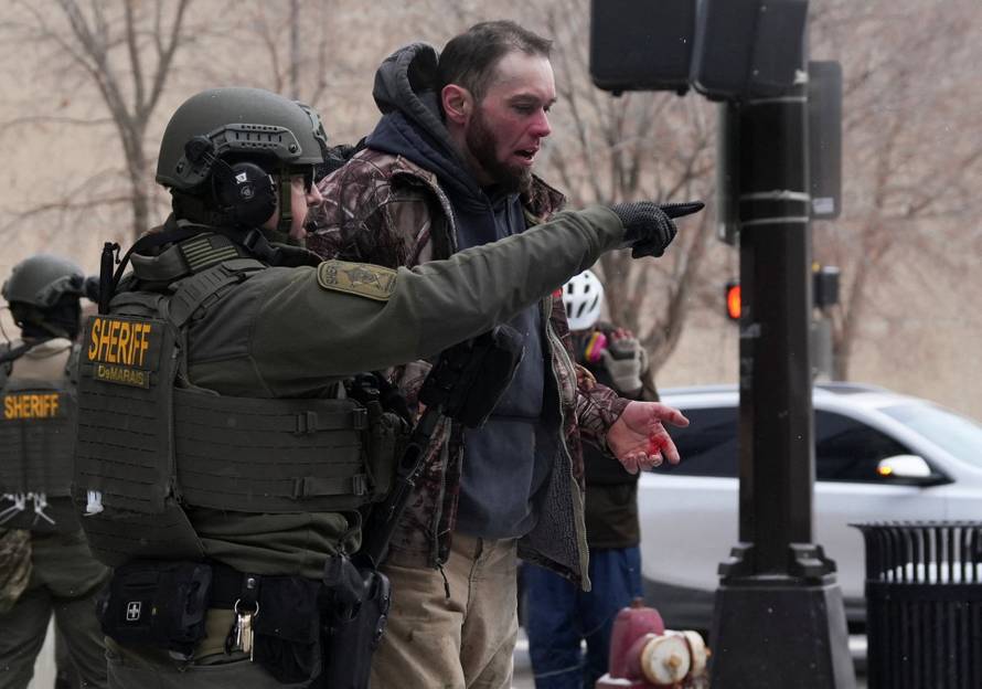 People attend the "March Against Minnesota Fraud" in Minneapolis