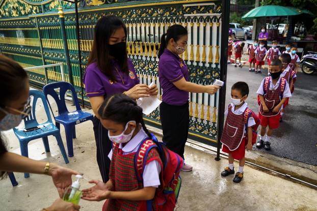 Thai kindergarten students rehearse social distancing and measures to prevent the spread of the coronavirus disease (COVID-19) in Bangkok
