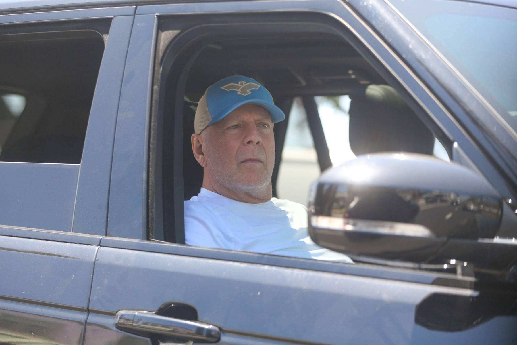 *EXCLUSIVE* Bruce Willis looking healthy and observing people on the street while out for a ride with a friend