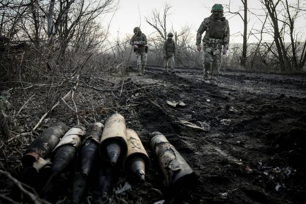 Ukrainian sappers inspect an area for mines and unexploded shells near the town of Chasiv Yar
