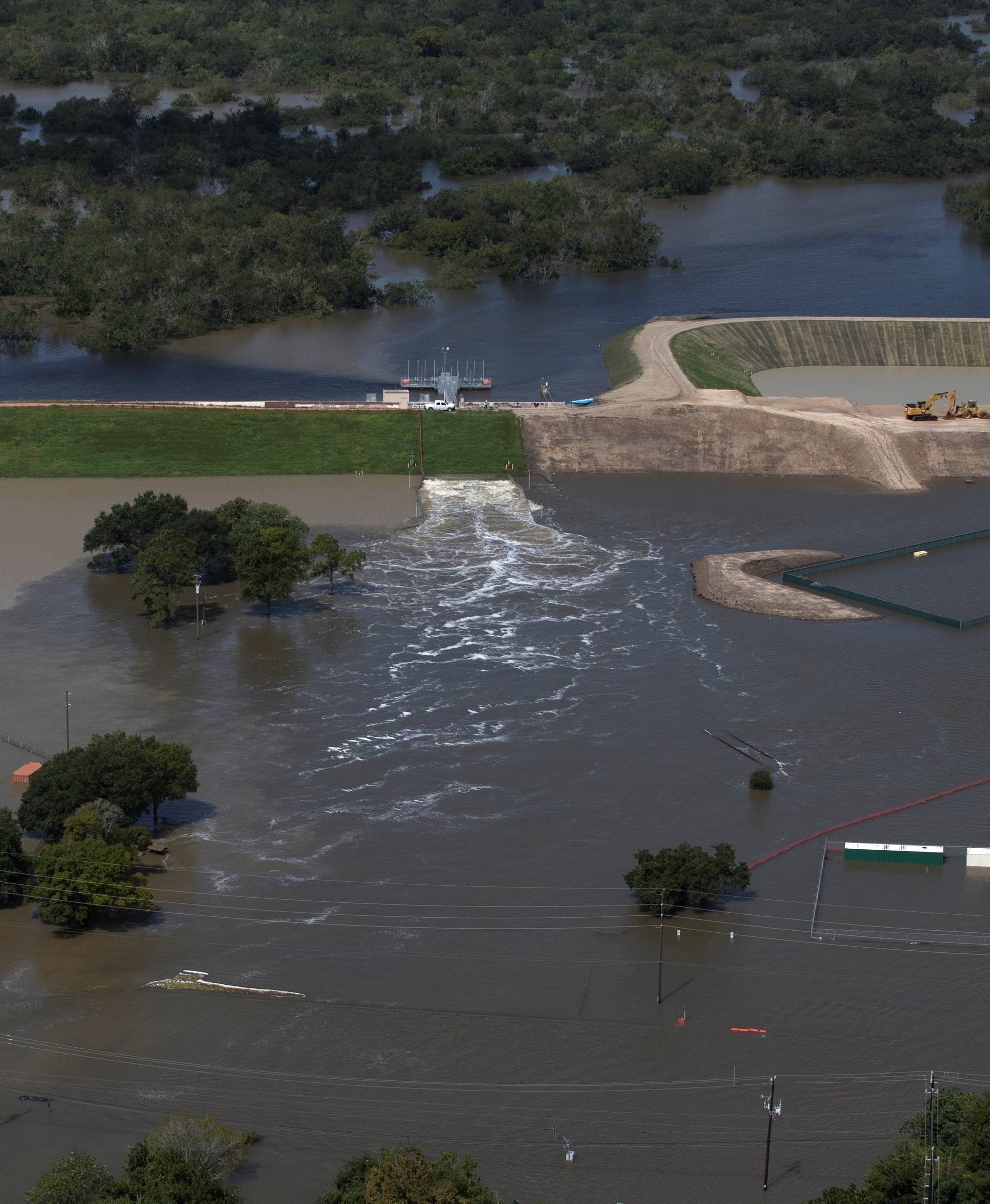 Rain water caused by Tropical Storm Harvey is released from the Barker Reservoir in West Houston, Texas