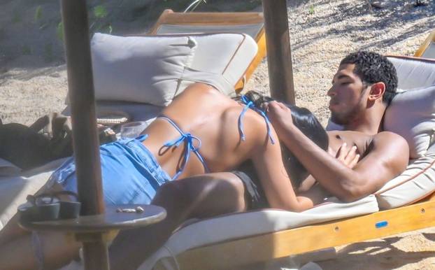 *PREMIUM-EXCLUSIVE* *MUST CALL FOR PRICING BEFORE USAGE* Real Madrid and England footballer Jude Bellingham and girlfriend Ashlyn Castro look smitten while soaking up the sun during a romantic holiday in Sardinia, as the England star takes a well-earned b