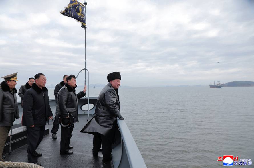 North Korean leader Kim Jong Un sails on board the Choe Hyon naval destroyer during a visit to inspect the vessel at the Nampho Shipyard