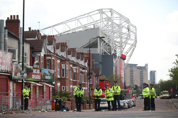 Manchester United fans protest against their owners before the Manchester United v Liverpool Premier League match