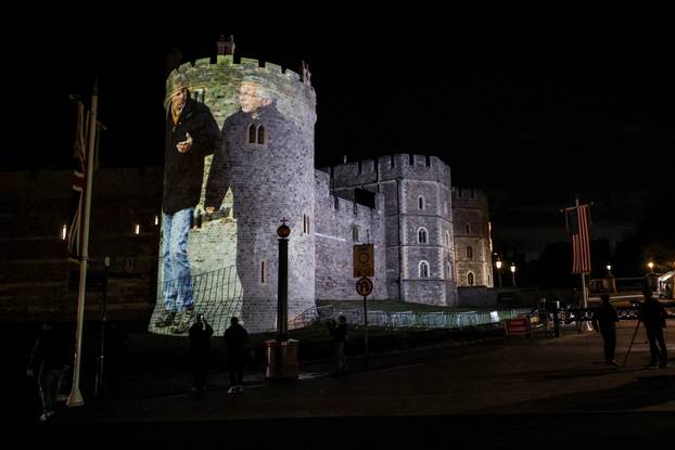 Image of Britain's Prince Andrew alongside disgraced financier Jeffrey Epstein is projected on Windsor castle