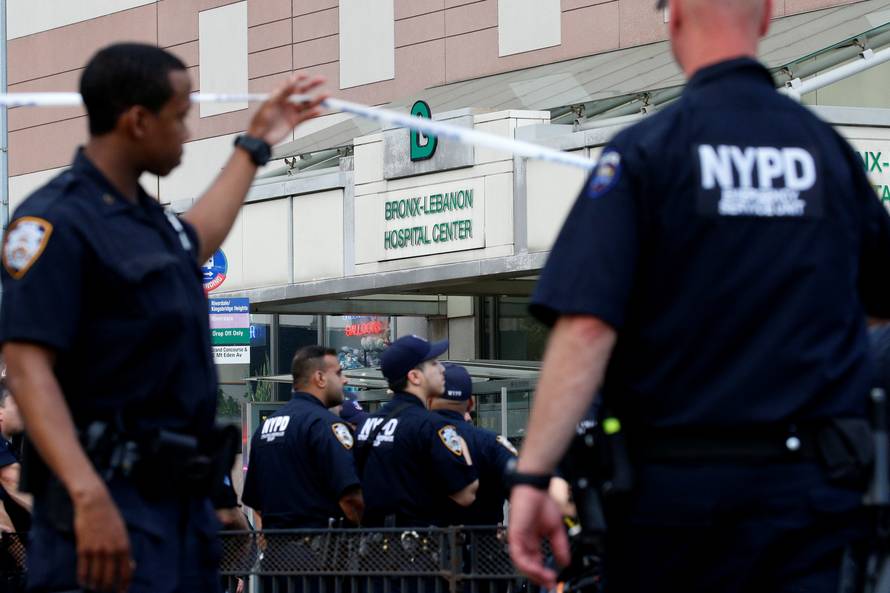 NYPD officers work outside Bronx-Lebanon Hospital, after an incident in which a gunman fired shots inside the hospital in New York