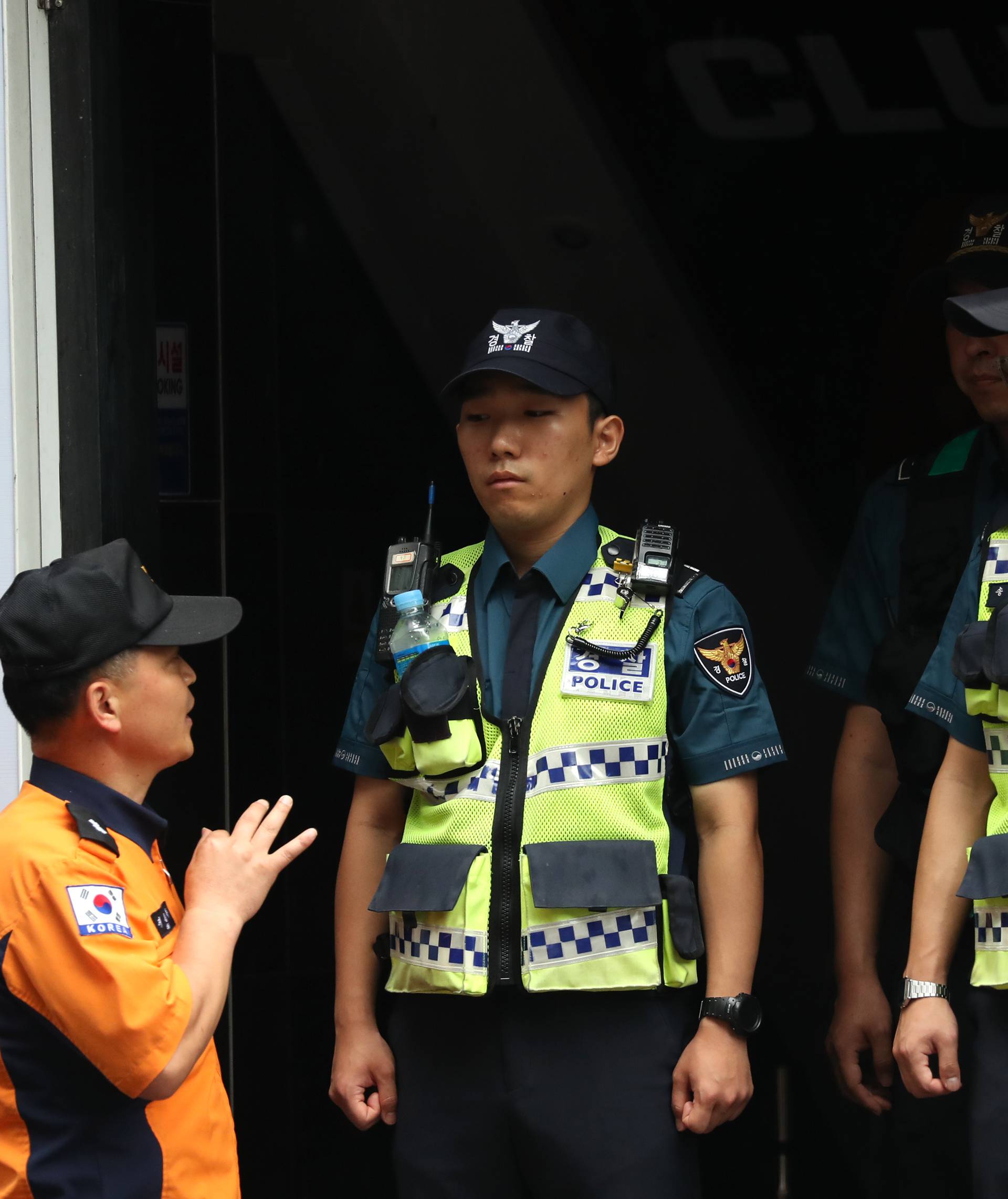 Police secure the area outside a night club after its upper floor collapsed in Gwangju