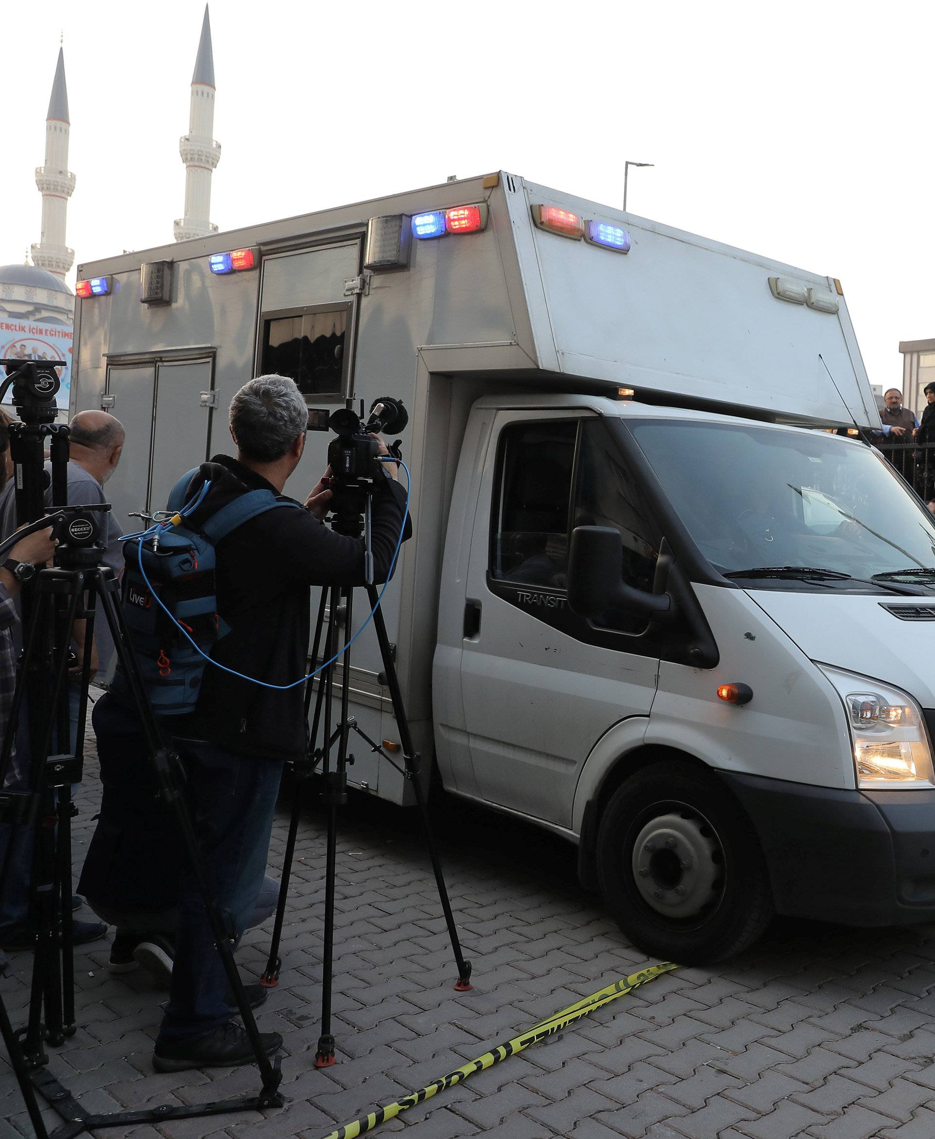 Turkish police and forensic experts arrive at a car park where a vehicle belonging to Saudi Arabia's consulate was found, in Istanbul