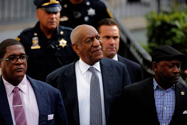 Actor and comedian Bill Cosby departs with comedian Joe Torry and publicist Andrew Wyatt after the fourth day of Cosby