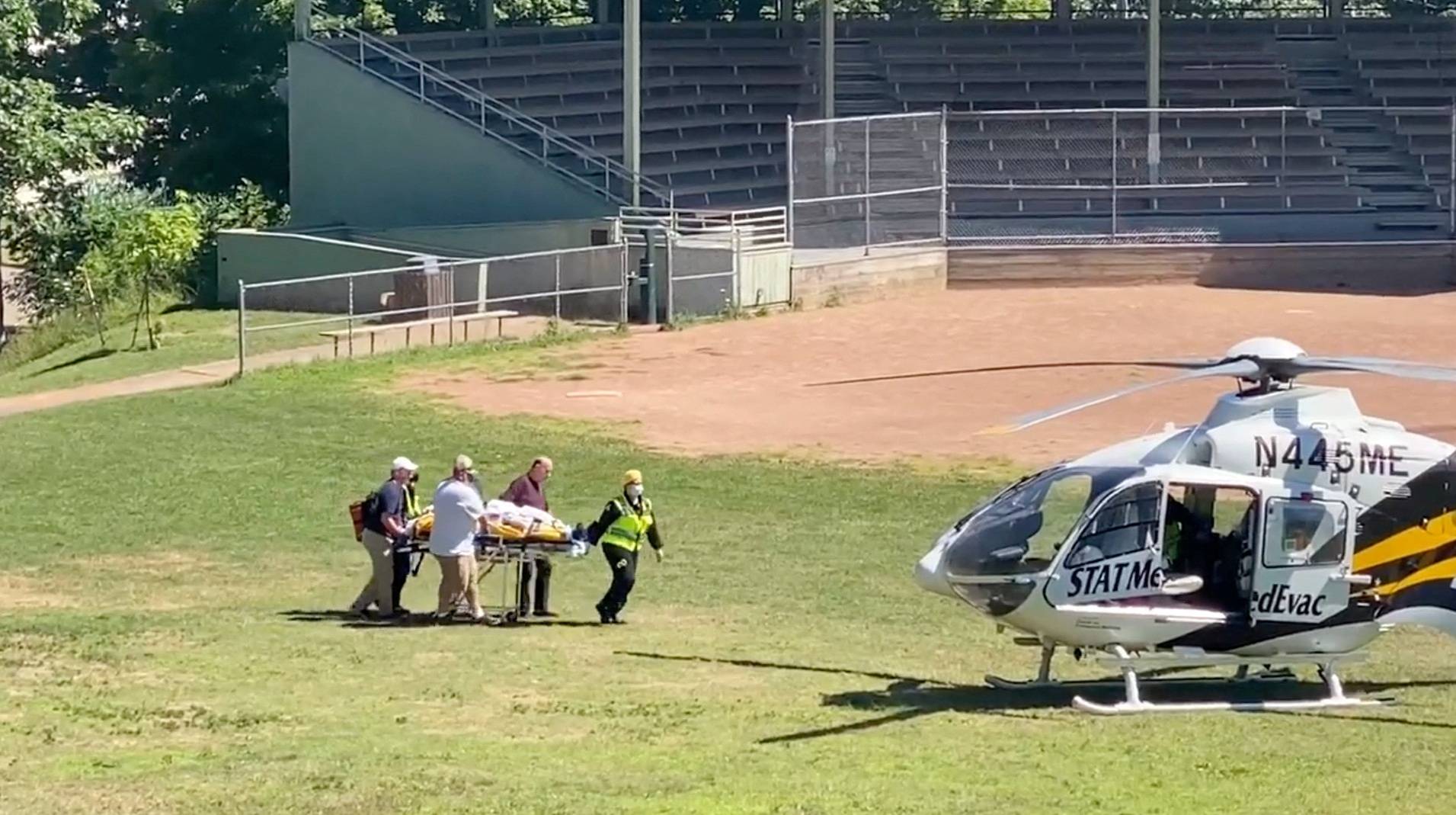 Author Salman Rushdie is transported to a helicopter after he was stabbed at the Chautauqua Institution