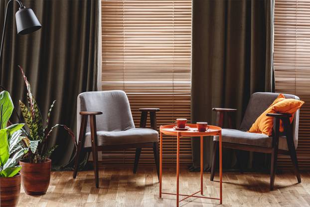 Vintage,Armchairs,,Orange,Coffee,Table,With,Two,Cups,,Plants,Standing