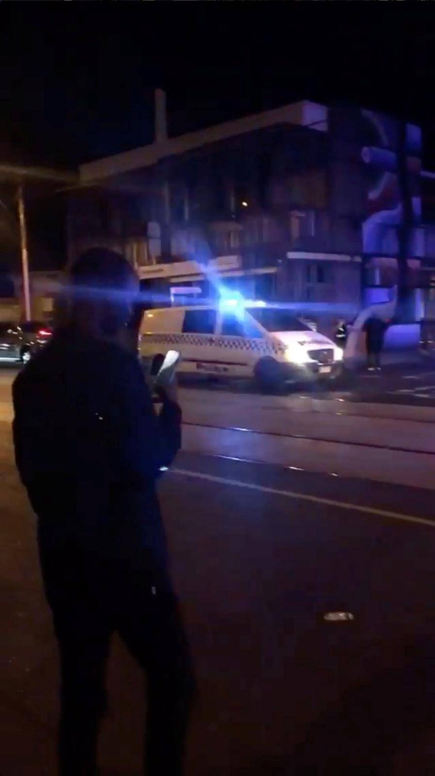 Police and rescue services are seen along a road following a shooting incident outside a nightclub, in Prahran, Melbourne, Australia in this still frame taken from social media video