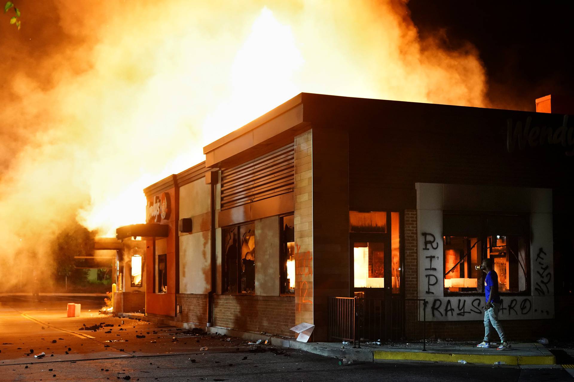 A Wendy’s burns following a rally against racial inequality and the police shooting death of Rayshard Brooks, in Atlanta