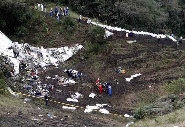 Rescue crew work at the wreckage of a plane that crashed into the Colombian jungle with Brazilian soccer team Chapecoense near Medellin