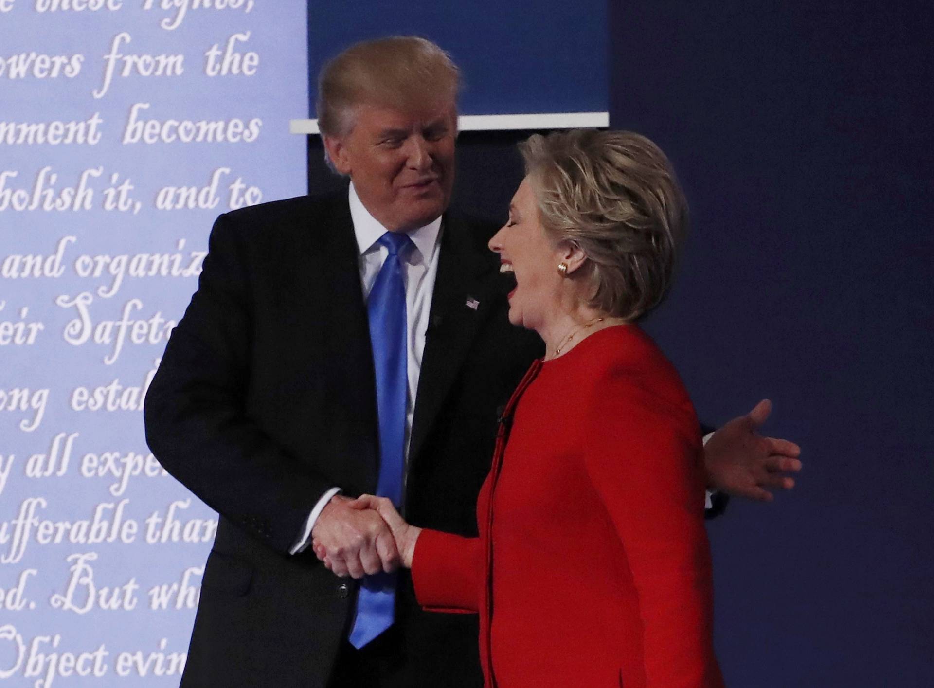 Republican U.S. presidential nominee Donald Trump shakes hands with Democratic U.S. presidential nominee Hillary Clinton at the conclusion of their first presidential debate at Hofstra University in Hempstead