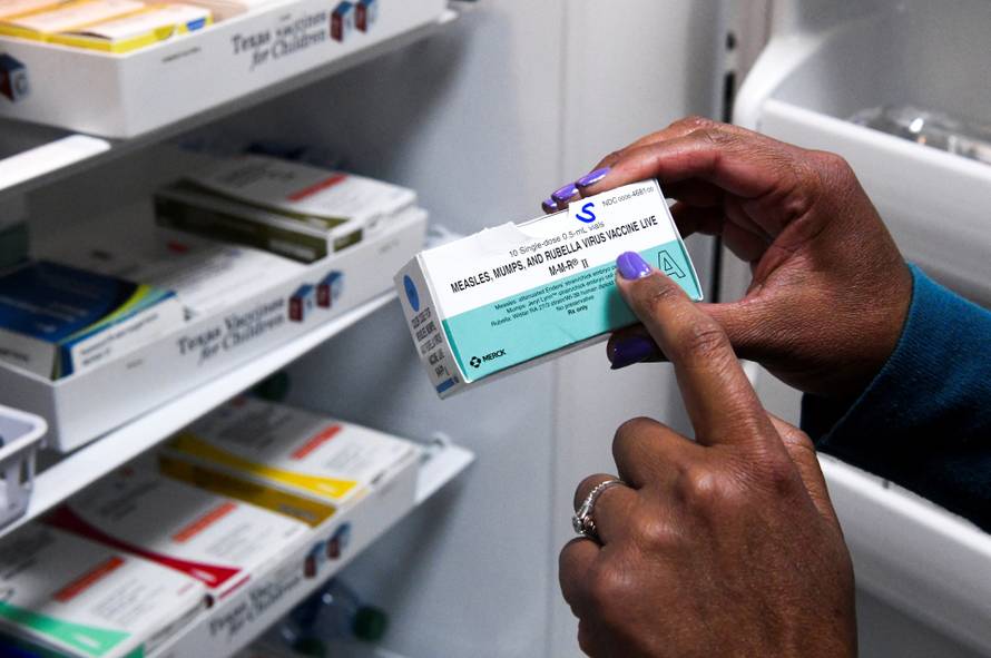 Dr. Ana Montanez points to MMR vaccines in Lubbock, Texas