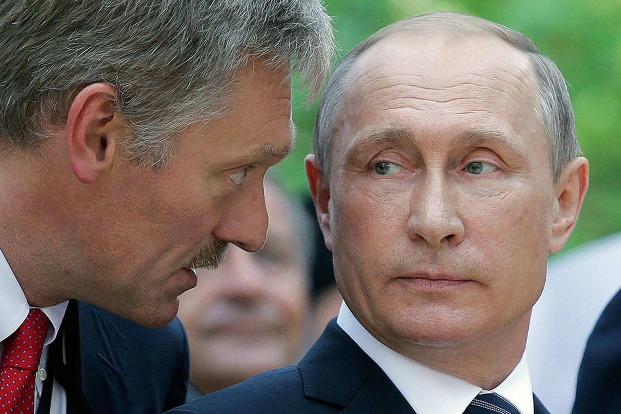 Russian president Vladimir Putin with his press secretary Dmitry Peskov