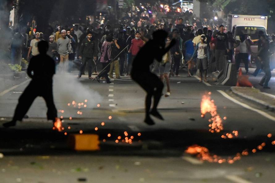 Protesters clash with the police downtown in Thamrin, Jakarta