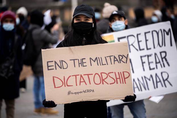 People attend a protest against the military coup in Myanmar, at Town Hall Square in Copenhagen