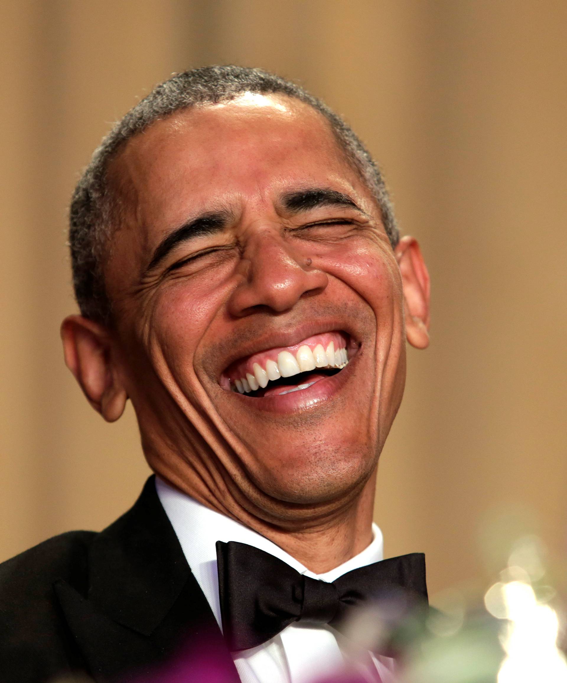 U.S. President Barack Obama laughts at the White House Correspondents' Association annual dinner in Washington