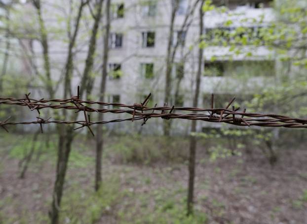 Barbed wire is seen surrounding a building in the abandoned city of Pripyat near the Chernobyl nuclear power plant