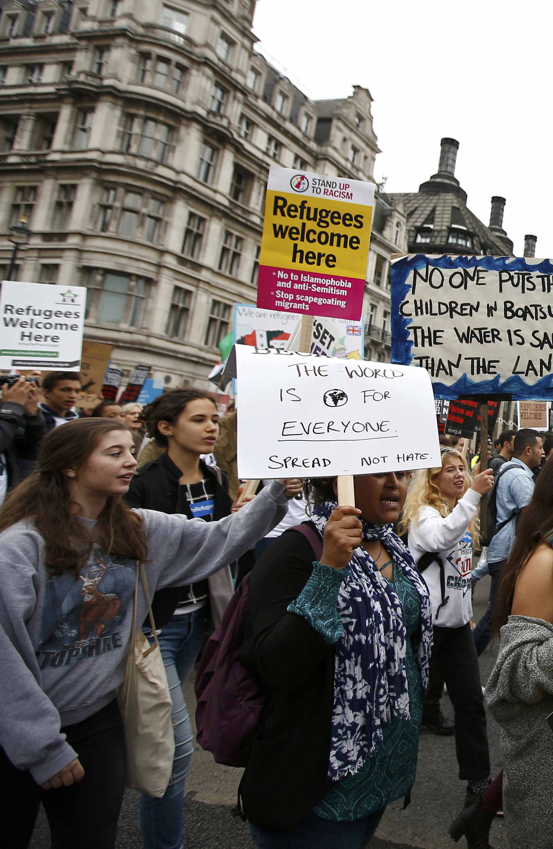 Demonstrators including refugees march to the Houses of Parliament during a protest in support of refugees, in London