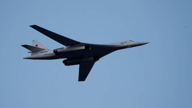 FILE PHOTO: Russian Tu-160 Supersonic Bomber flies during a military parade marking the Belarus Independence Day in Minsk