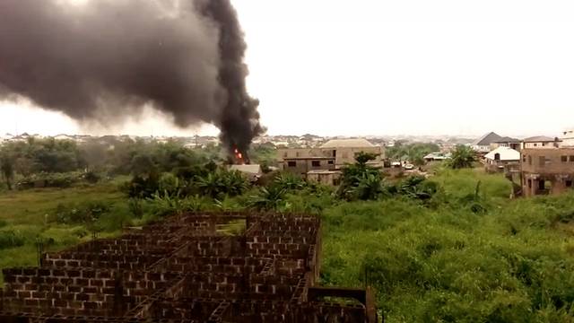 Smoke fills the air following a pipeline explosion in the residential area of Iyana Odo, Isheri-Olofin, Lagos