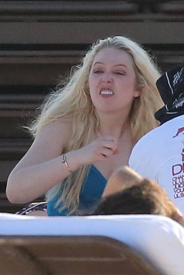 *NO WEB UNTIL 1500 EDT 15TH OCT PREMIUM EXCLUSIVE* Tiffany Trump wears a blue swimsuit and appears to go through a range of emotions as she relaxes on the beach with friends on her birthday in Miami