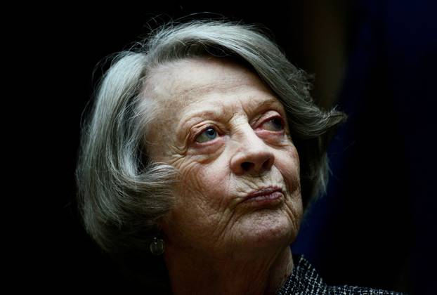 FILE PHOTO: Downton Abbey cast member Maggie Smith poses for the media at a hotel in London