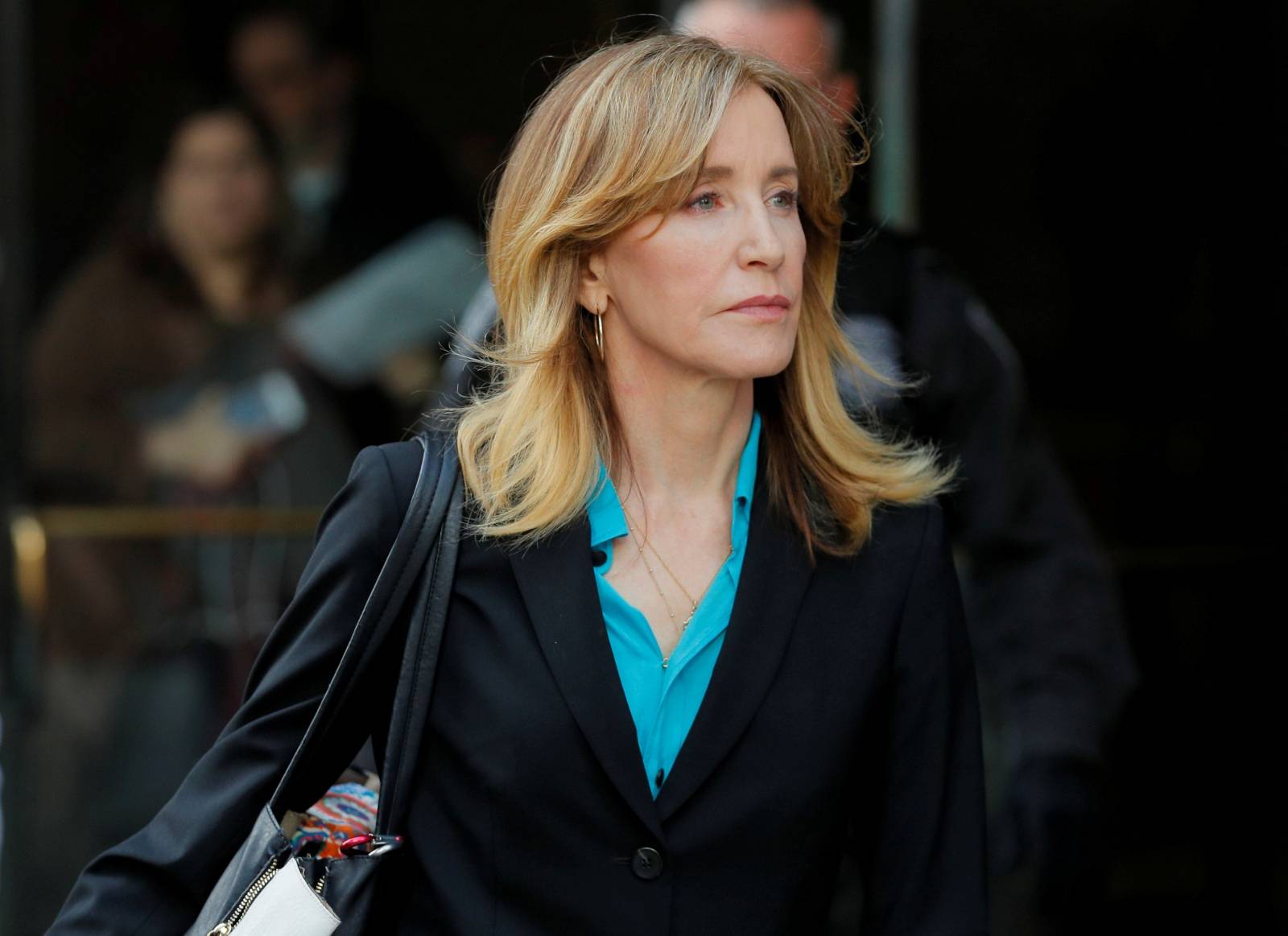 FILE PHOTO: Actor Felicity Huffman, facing charges in a nationwide college admissions cheating scheme, leave federal court in Boston