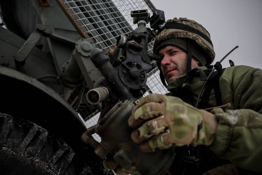 Ukrainian servicemen fire a Grad MLRS towards Russian troops near the frontline town of Chasiv Yar