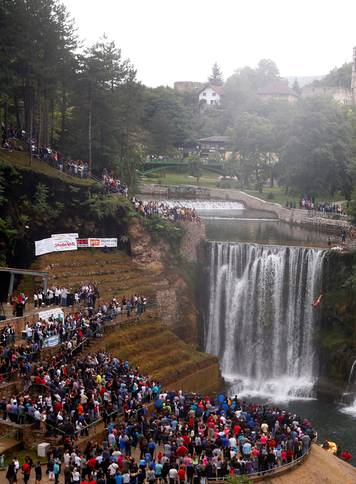 A competitor takes part in the third international waterfall jumping competition held in the old town of Jajce