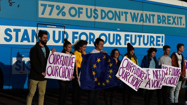 Students from anti-Brexit protest group 'Our Future Our Choice' demonstrate outside Stormont parliament building in Belfast