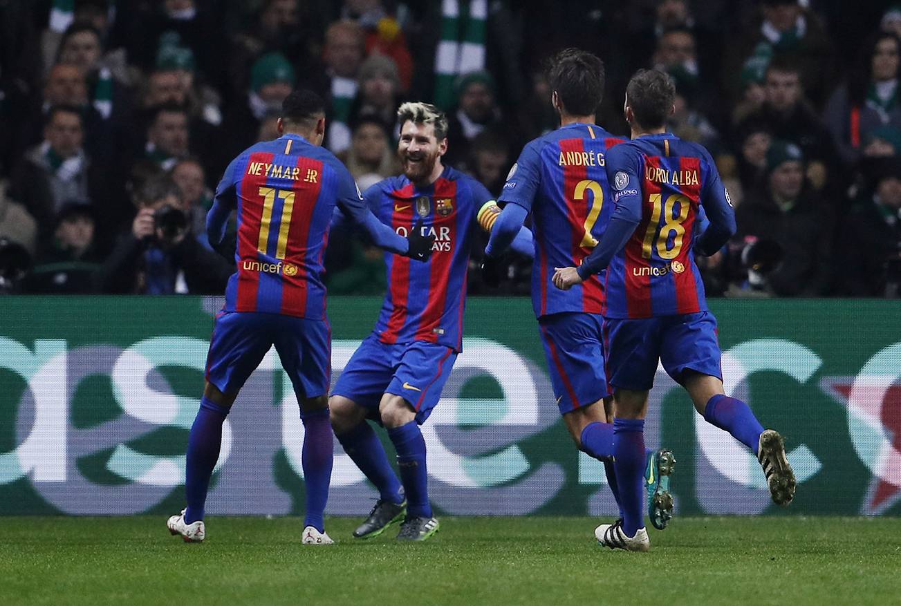 Barcelona's Lionel Messi celebrates scoring their first goal with team mates