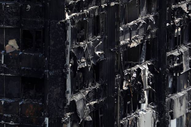 Extensive damage is seen to the tower block that was destroyed in a fire disaster, in north Kensington, West London