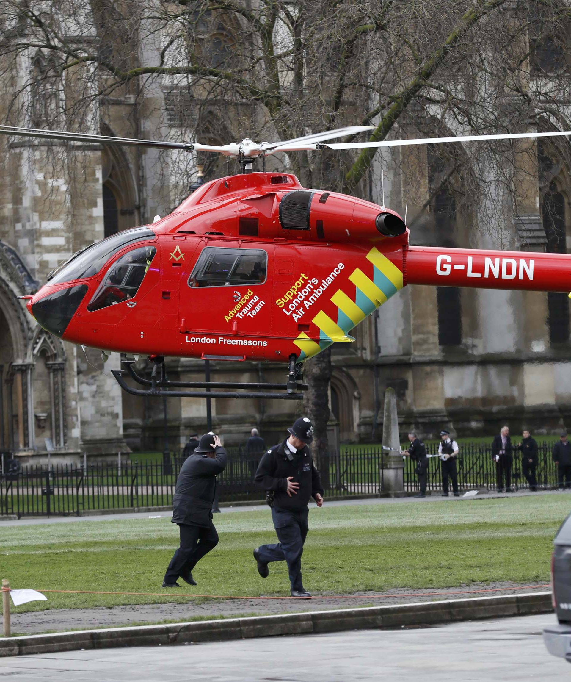 An air ambulance lands in Parliament Square during an incident on Westminster Bridge in London