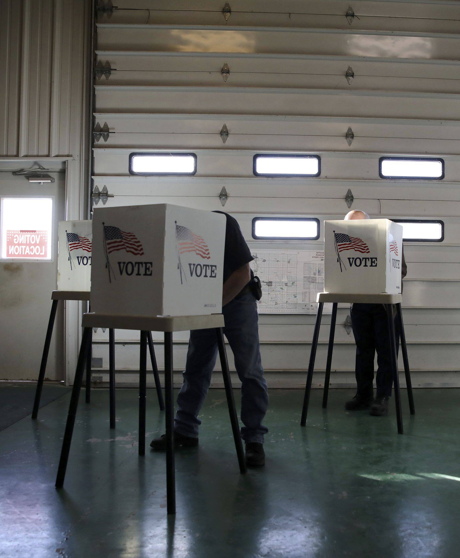 Voters cast ballots in polling station located in a farm shed during the U.S. presidential election near Nevada, Iowa