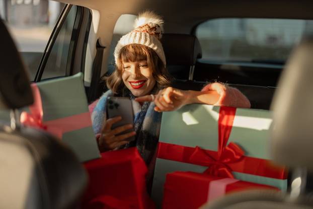 Young,Woman,Dressed,For,The,Holidays,Drives,In,Car,On