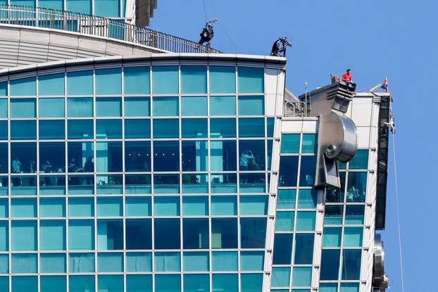 Climber Alex Honnold takes a break while free soloing Taipei 101 Skyscraper in Taipei