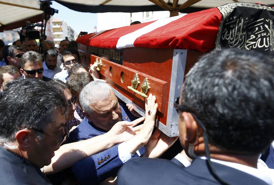 A coffin with a victim of the thwarted coup is carried to a funeral service in Ankara