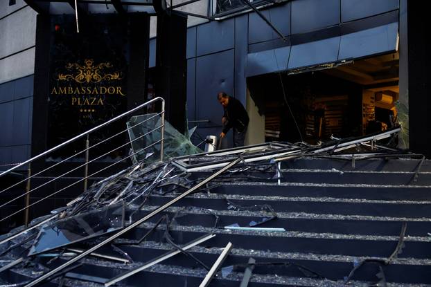 Rescuers work at the site of a Russian missile strike, amid Russia's attack on Ukraine, in Kyiv