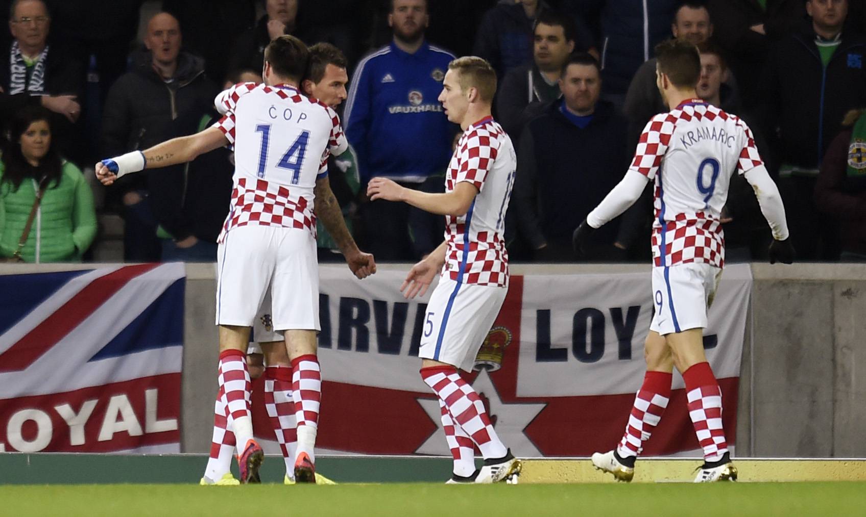 Croatia's Mario Mandzukic celebrates scoring their first goal with Duje Cop and teammates