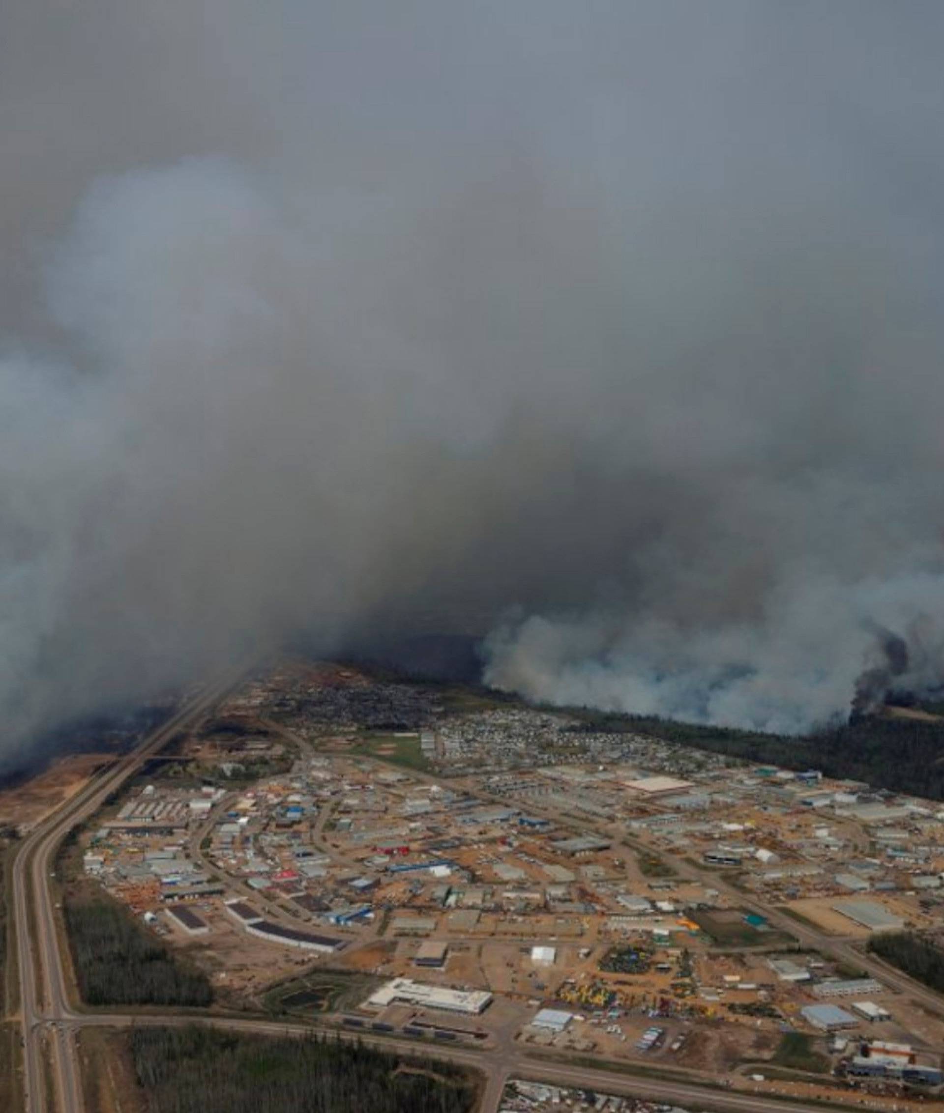 A Canadian Joint Operations Command aerial photo shows wildfires near neighborhoods in Fort McMurray Alberta Canada