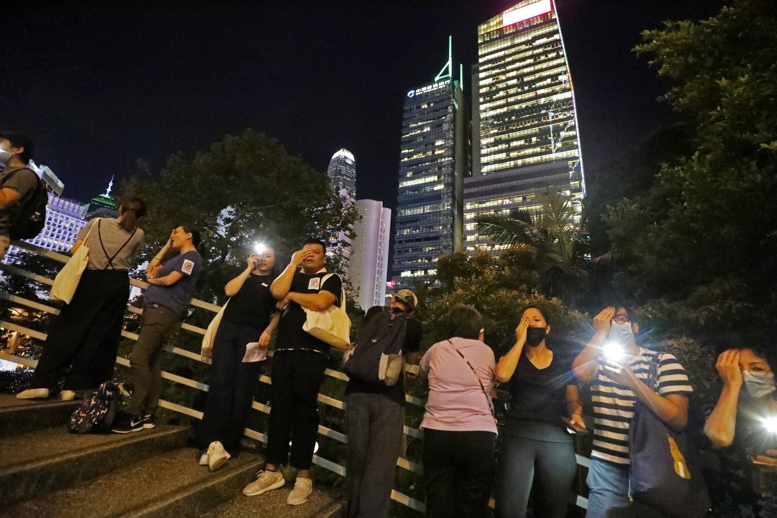 Protesters stand next to each other to form a human chain during a rally to call for political reforms in Hong Kong