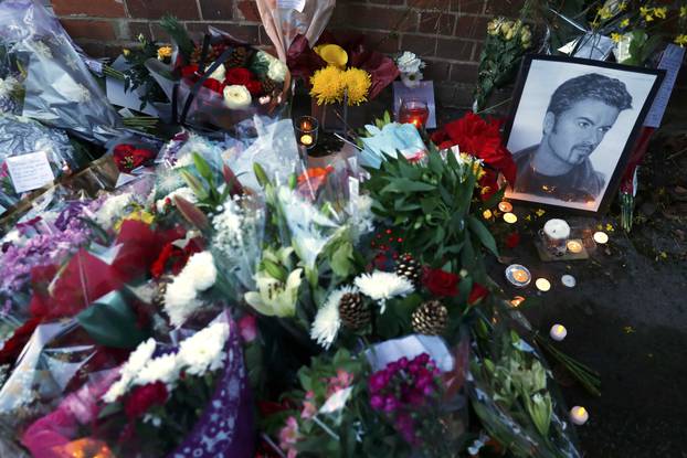 Tributes are seen outside the house of singer George Michael, where he died on Christmas Day, in Goring, southern England