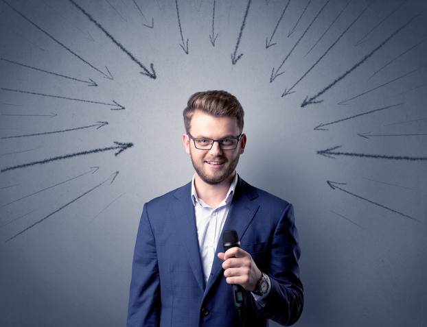 Businessman holding microphone