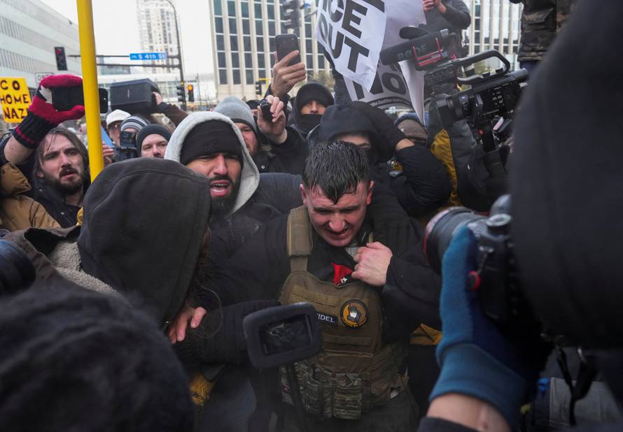 People attend the "March Against Minnesota Fraud" in Minneapolis