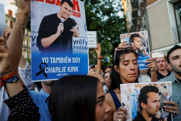 People mourn Charlie Kirk outside the U.S. embassy in Madrid
