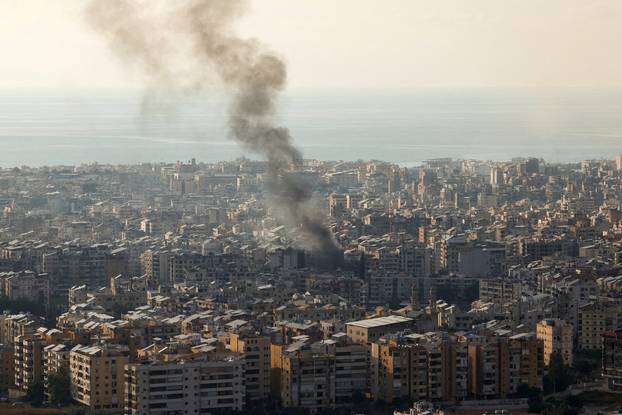 Smoke rises over Beirut's southern suburbs from generator fire, according to residents